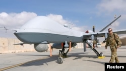 在阿富汗坎大哈空军基地的美国空军MQ-9“收割者”无人机。（2018年1月23日）