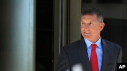 Former Trump national security adviser Michael Flynn leaves federal courthouse in Washington, July 10, 2018, following a status hearing.