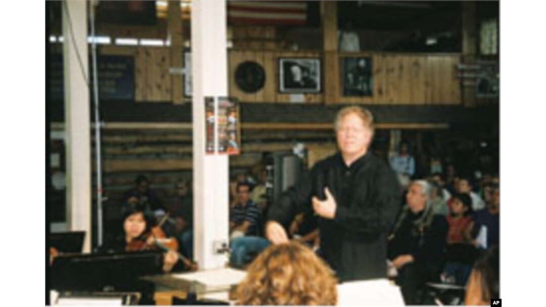 Delta David Gier leads the South Dakota Symphony Orchestra and the Porcupine Singers in a performance by the The Lakota Music Project.