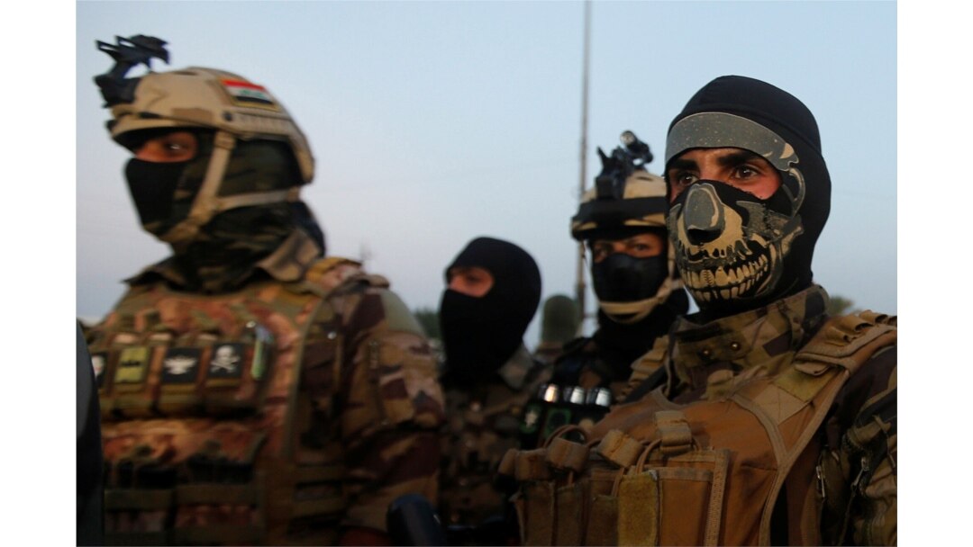 Members of the Iraqi security forces are seen during anti-government protests in Basra, Iraq, Nov. 9, 2019.