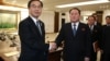 South Korean Unification Minister Cho Myoung-gyon, left, shakes hands with the head of North Korean delegation Ri Son Gwon after their meeting at the Panmunjom in the Demilitarized Zone in Paju, South Korea, Jan. 9, 2018.