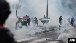 FILE - Smoke fills the air during a pro-Palestinian rally called against Israel's bombardment of the Palestinian Gaza Strip, in Paris, France, May 15, 2021. 