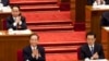 2012年3月11日，令計劃(坐在溫家寶後面)和胡錦濤、溫家寶一起出席中國人大會議。