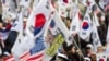 Supporters of former South Korean president Park Geun-hye protest in front of a court after prosecutors sought a 30 year jail term for the ousted president in Seoul, South Korea, Feb. 27, 2018. 