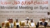 Khalid al-Attiyah, left, Qatari acting minister of business and trade, and Qatari Prime Minister and Foreign Minister Hamad bin Jassim, listen as U.S. Secretary of State John Kerry speaks during a meeting of the London 11 "Friends of Syria" meeting in Doh