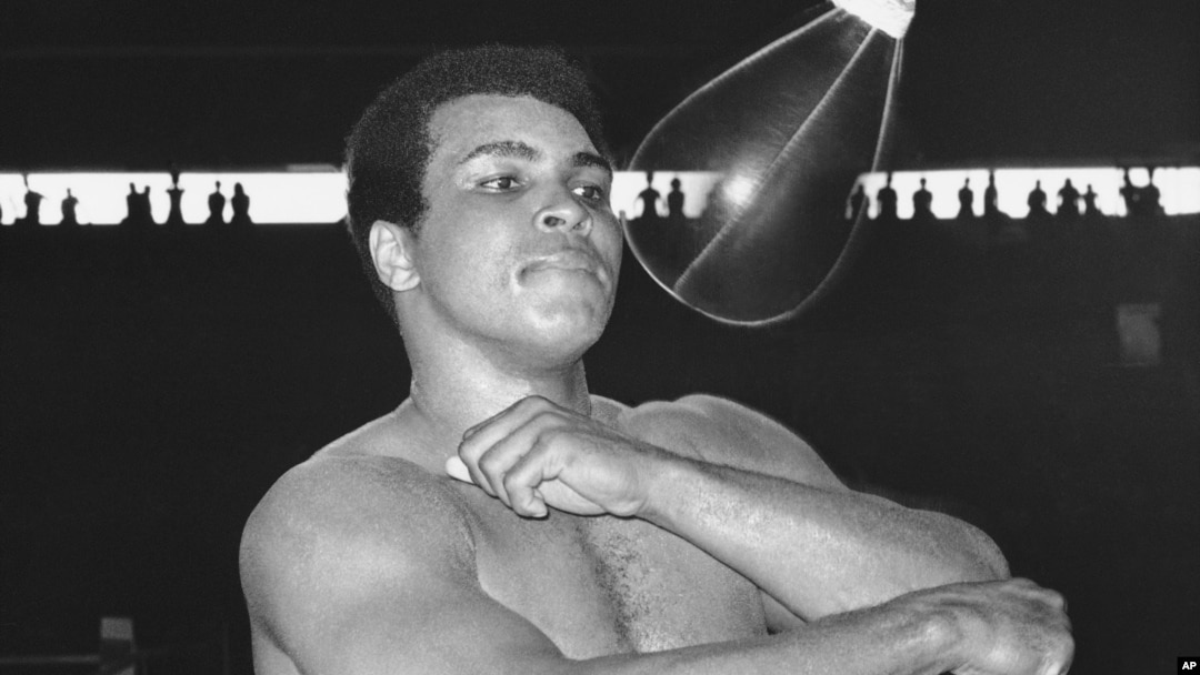 FILE - Muhammad Ali, world heavyweight champion, punches speed bag at the Folk Art Center in Manila, Philippines, Sept. 29, 1975, as he prepares his title fight on October 1 with Joe Frazier. 