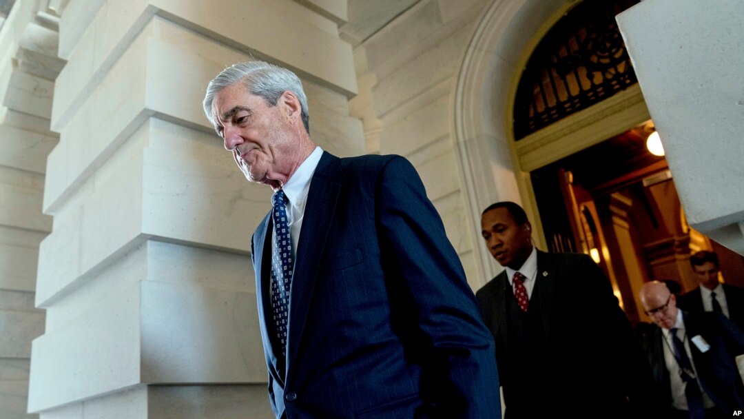 FILE - Former FBI Director Robert Mueller, the special counsel probing Russian interference in the 2016 election, departs Capitol Hill following a closed door meeting, June 21, 2017.