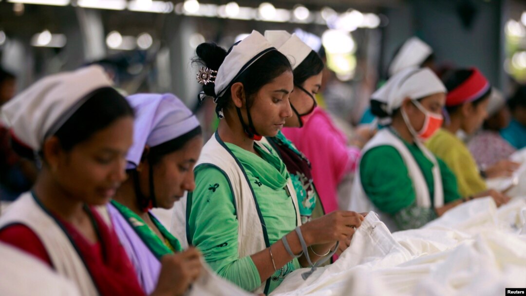 FILE - Women work at Goldtex Limited garment factory inside the Dhaka Export Processing Zone (DEPZ) in Savar, April 11, 2013. 
