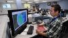 A Walmart meteorologist at his station in the disaster operations center checking on Sandy's progress (Walmart)