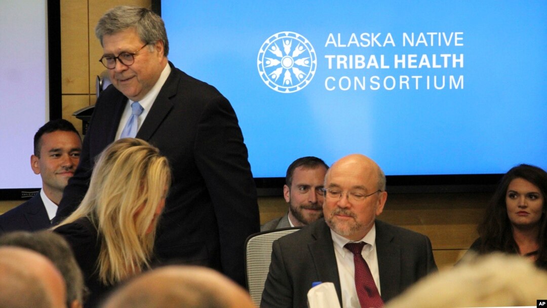 U.S. Attorney General William Barr, standing, greets participants at a roundtable discussion at the Alaska Native Tribal Health Consortium, May 29, 2019, in Anchorage, Alaska.