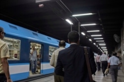 Power outages sometimes bring trains to a standstill, causing passengers to force open train doors and walk along the rails to the next station.
