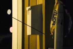 An arrow left in a wall is seen after several people were killed and others were injured by a man using a bow and arrows to carry out attacks, in Kongsberg, Norway, October 13, 2021.