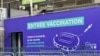 A sign marks the entrance of the Stade de France vaccination center in Saint Denis. (Lisa Bryant/VOA)