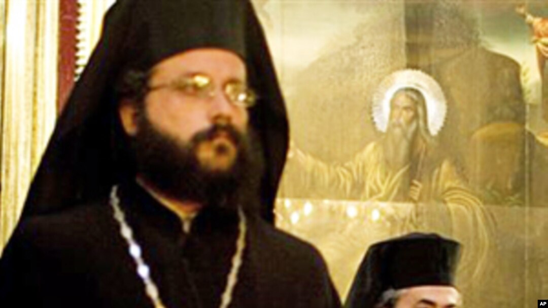 Greek Orthodox Patriarch of Jerusalem Theofilos III (r) visits the Mar-Elias monastery during the Greek Orthodox Christmas Eve in Jerusalem, 6 Jan 2011
