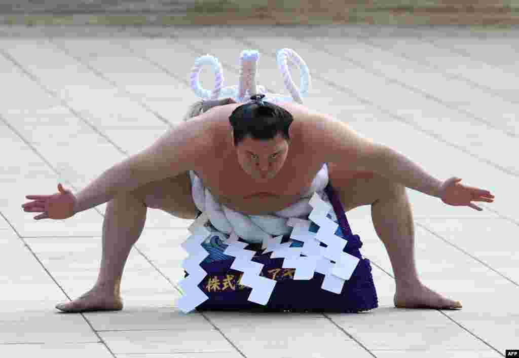 "Yokozuna" or sumo grand champion Hakuho of Mongolia takes part in a traditional ring-entering ceremony at Meiji shrine in Tokyo, Japan.