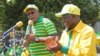 Nape Nnauye, spokesman for the ruling Chama Cha Mapinduzi party, speaks alongside President-elect John Magufuli. (Credit: Nape Nnauye)
