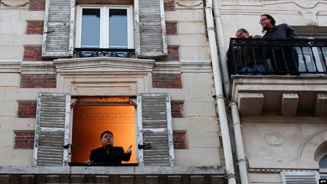 Keeping windows open can help move good air in and bad out. Here, French singer Stephane Senechal sings from his apartment's open window in Paris. A lockdown was imposed to slow the rate of the coronavirus disease (COVID-19) spread, March 24, 2020. REUTERS/Gonzalo Fuentes