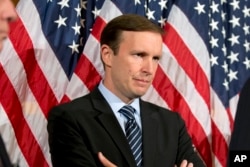 FILE - Sen. Chris Murphy, D-Conn., stands during a media availability on Capitol Hill in Washington, June 20, 2016.