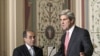 Senate Foreign Relations Committee Chairman Sen. John Kerry (r) with Mahmoud Jibril, representative for foreign affairs with the Libyan Transitional National Council, after their meeting on Capitol Hill in, May 11, 2011