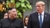 US President Donald Trump (R) walks with North Korea's leader Kim Jong Un during a break in talks at the second US-North Korea summit at the Sofitel Legend Metropole hotel in Hanoi on Feb. 28, 2019.