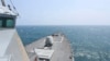 FILE - In this photo provided by the U.S. Navy, the Arleigh Burke-class guided-missile destroyer USS Halsey conducts routine underway operations while transiting through the Taiwan Strait May 8, 2024.