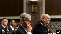 Army Secretary John M. McHugh, left, and Army Chief of Staff Gen Raymond Odierno update members of the Senate Armed Services Committee about the deadly shooting rampage by a soldier yesterday at Fort Hood in Texas, April 3, 2014.