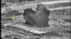 An image taken from footage made available on the Russian Defense Ministry's official website purports to show an explosion after airstrikes carried out by the Russian air force, Oct. 3, 2015.