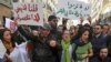 Demonstrators rally to denounce President Abdelaziz Bouteflika's bid for a fifth term, in Algiers, Algeria, Feb. 24, 2019.