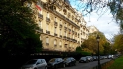 FILE - Teodorin Obiang's 101-room mansion, at left, with country flag, which Equatorial Guinea argues is the country's mission in France. (L. Bryant/VOA)