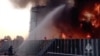 FILE - Members of the Russian emergencies ministry work to extinguish fire at an oil storage tank after an alleged drone attack in the town of Azov, in Russia's Rostov region, June 18, 2024, in this still image taken from video. (Russian Emergencies Ministry/Handout via Reuters)