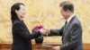 North Korean leader Kim Jong Un's sister Kim Yo Jong hands a signed letter from Kim Jong Un to South Korea's President Moon Jae-in during their meeting at the presidential Blue House in Seoul, Feb. 10, 2018.