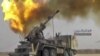 A picture taken from video provided Nov 8, 2017 by the government-controlled Syrian Central Military Media shows shelling on militants' positions on the Iraq-Syria border. 