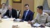 Russian President Vladimir Putin (2nd L) and Syrian President Bashar al-Assad (2nd R) meet with servicemen as they visit the Hmeymim air base in Latakia Province, Syria, Dec. 11, 2017. 