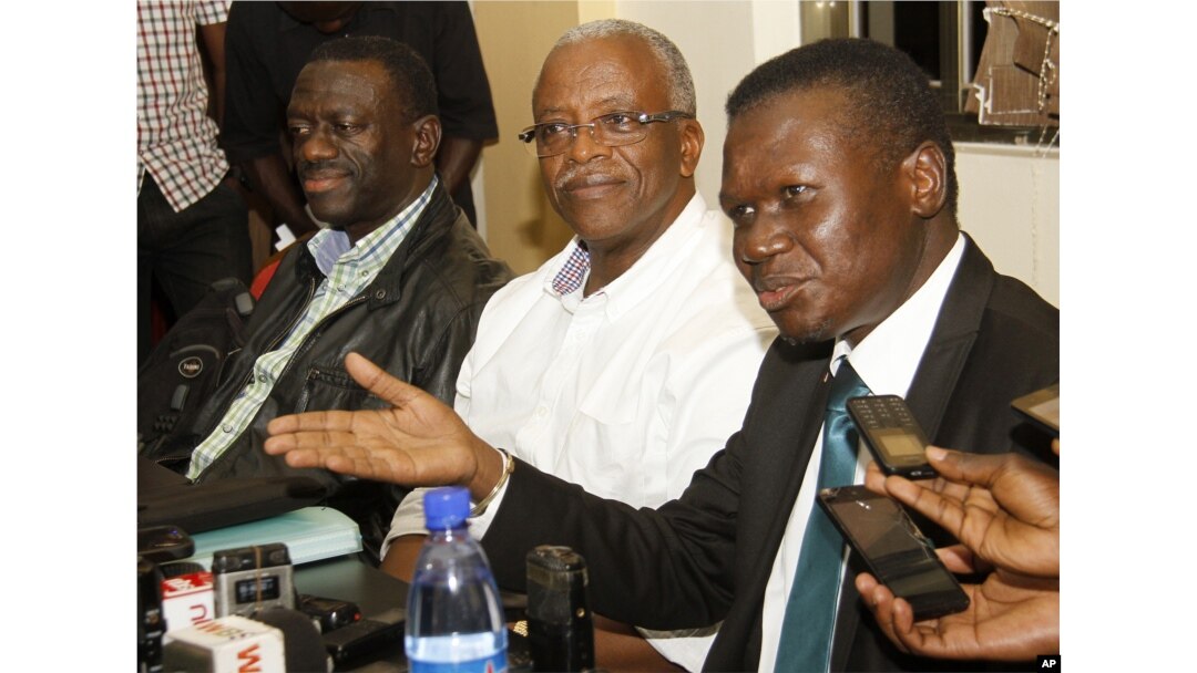 FILE - Uganda opposition leaders, from left to right: Forum for Democratic Change, Dr. Kizza Besigye, former Prime Minister Amama Mbabazi and Democratic Party President Norber Mao meeting at the Democratic Alliance office in Kampala, Sept. 18, 2015.