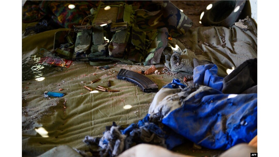 Ammunitions are seen left on a bed inside an army-linked militia post a day after clashes between Myanmar forces and ethnic rebels in Muse, May 13, 2018.