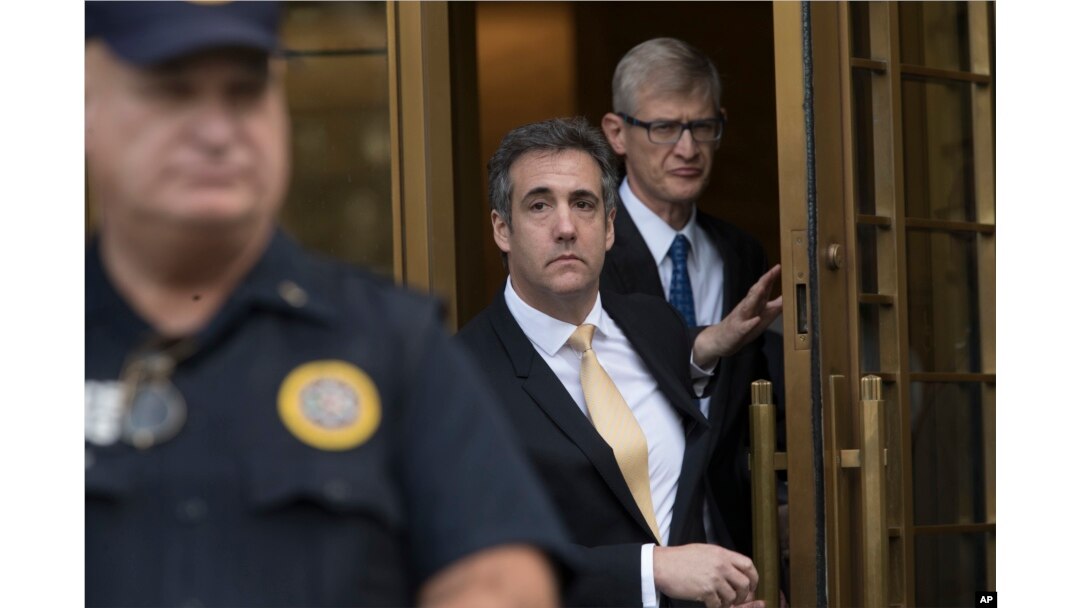 President Donald Trump's former attorney Michael Cohen (C) leaves Federal court, Aug. 21, 2018, in New York.