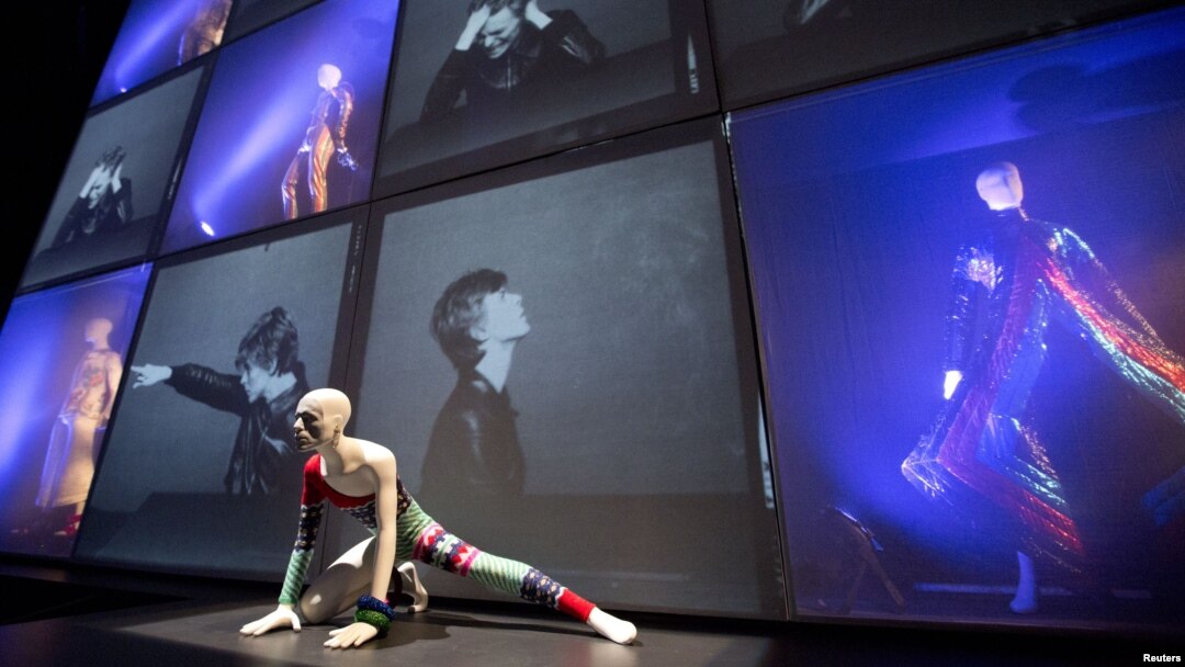 A striped asymmetric catsuit by Yansai Yamamoto (1973), used by performer David Bowie, is seen at the "David Bowie is" Exhibition in London, March 20, 2013.