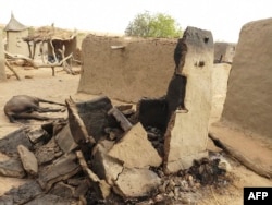 FILE - A destroyed home is seen on June 11, 2019, in a Dogon village in Mali after an attack on ethnic Dogon on June 9, 2019.