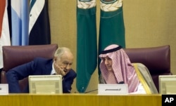 Arab League chief Ahmed Aboul Gheit talks to Saudi Arabia's Foreign Minister Adel Jubeir, right, during the Arab Foreign Ministers meeting at the Arab League headquarters in Cairo, Egypt, May 17, 2018.