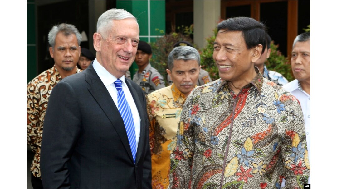 U.S. Defense Secretary Jim Mattis, left, smiles with Indonesian Coordinating Minister for Politics, Security and Law Wiranto after a meeting in Jakarta, Indonesia, Jan. 23, 2018.