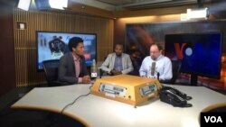 FILE - Ethiopian runner and silver medalist in the Rio Olympics Feyisa Lilesa, left, his translator and VOA reporter Dan Joseph at the Voice of America in Washington, Sept. 15, 2016. (Photo: Rudan Balay / VOA)