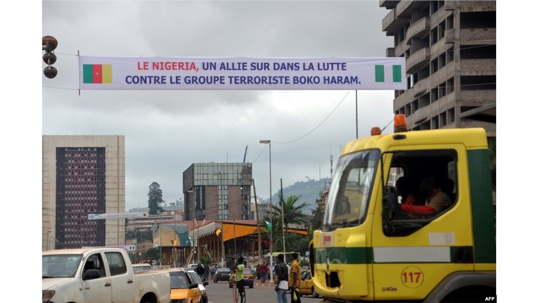 FILE - A banner reads 'Nigeria - an ally in the fight against terrrorist group Boko Haram' in Yaounde, Cameroon, July 28, 2015.