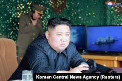 North Korea's leader Kim Jong Un supervises a "strike drill" for multiple launchers and tactical guided weapon into the East Sea during a military drill, May 4, 2019