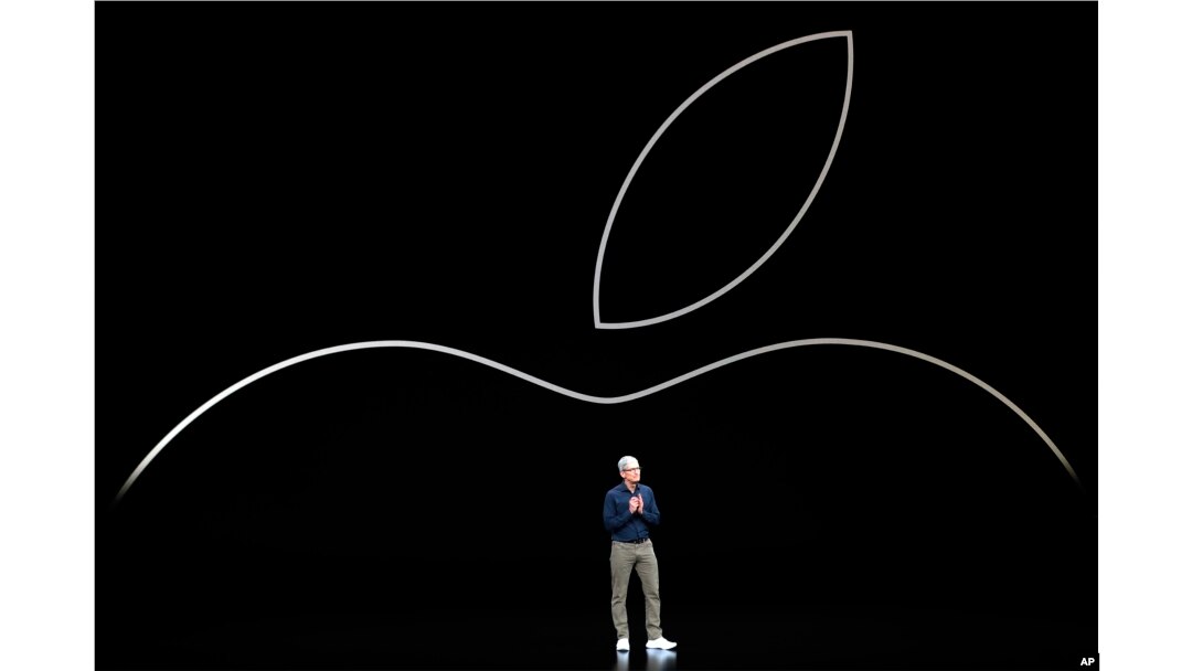 FILE- Apple CEO Tim Cook discusses the new Apple iPhones and other products at the Steve Jobs Theater during an event to announce new products in Cupertino, California, Sept. 12, 2018.