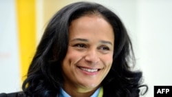In this photograph taken on Feb. 5, 2018, Angolan businesswoman Isabel dos Santos looks on as she visits EFACEC's new electric mobility industrial unit in Maia, central Portugal.