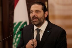 Lebanese Prime Minister Saad Hariri addresses the nation, in Beirut, Lebanon, Oct. 18, 2019. Hariri has given his political adversaries a 72-hour ultimatum to back his reform agenda amid growing nationwide protests over a worsening economic crisis.