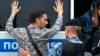 Police officer detains a supporter of Russian investigative journalist Ivan Golunov during a march in Moscow, Russia, Wednesday, June 12, 2019.