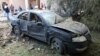 A damaged car is seen during clashes between rival factions in Tripoli, Libya, Aug. 30, 2018. 