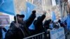 Uighurs and their supporters protest in front of the Permanent Mission of China to the United Nations in New York, March 15, 2018. Uighur Muslims protested a sweeping Chinese surveillance and security campaign that has sent thousands to detention camps.