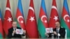 FILE - A picture taken and released on Dec. 10, 2020, by the Turkey shows Turkish President Recep Tayyip Erdogan and Azerbaijani President Ilham Aliyev holding a press conference following their meeting in Baku.